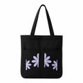 Suryatra Lavender Daisy Noir Canvas Tote Bag for Women & Men | Premium Cotton Canvas Shoulder Bag with Dual Front Pockets | Tote Bag for Office, College, Shopping & Travel | Black | 14 x 16 Inches
