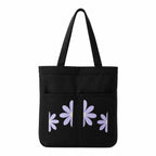 Suryatra Lavender Daisy Noir Canvas Tote Bag for Women & Men | Premium Cotton Canvas Shoulder Bag with Dual Front Pockets | Tote Bag for Office, College, Shopping & Travel | Black | 14 x 16 Inches