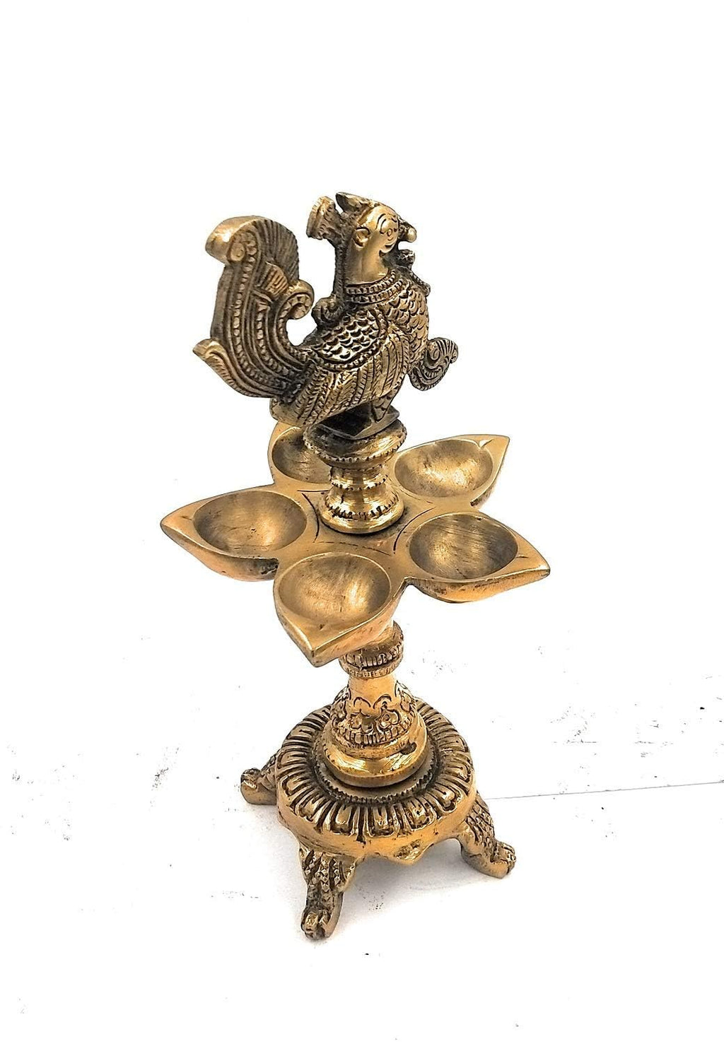 Svarup Brass Peacock Diya with Four Lamps on Stand in Gold Color Color: an Exquisite Diya Featuring Four Lamps in a Peacock Design, Placed on a Stand