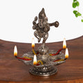 INTERNATIONAL GIFT Silver Plated Dancing Lord Ganesha Idol with Diya – Showpiece for Mandir, Pooja & Home Décor