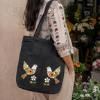Suryatra Folk Art Mosaic Canvas Tote Bag for Women & Men | Premium Cotton Canvas Shoulder Bag with Dual Front Pockets | Tote Bag for Office, College, Shopping & Travel | Black | 14 x 16 Inches