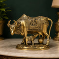 ARTVARKO Brass Laxmi Ganesha Engraved Cow and Calf Statue Kamdhenu Gau MATA Idol, Spiritual Vastu Nandi Pooja Decor, Gold Color 8 Inch