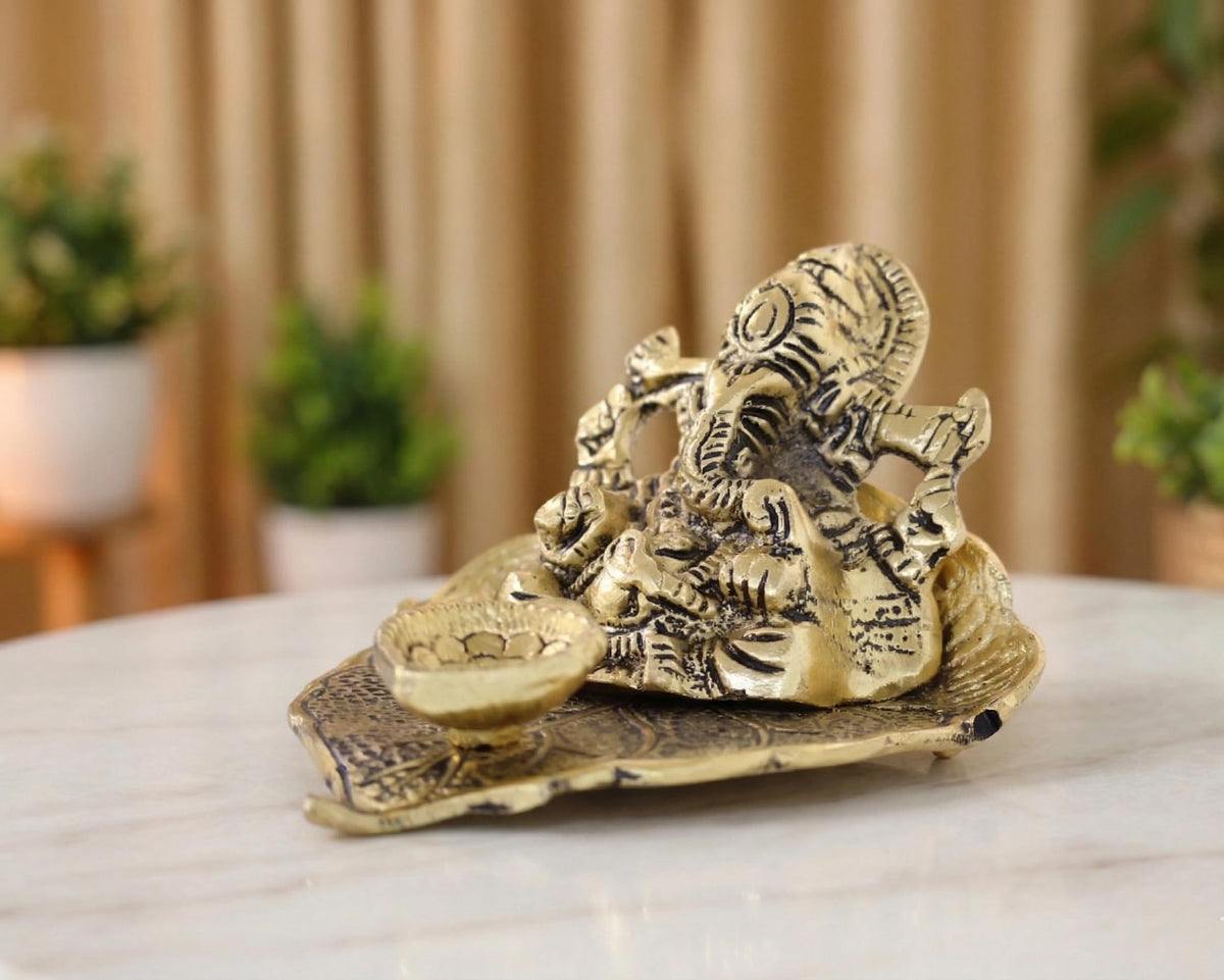 KridayKraft Metal Lord Ganesha On Leaf With Diya Idol For Pooja Room Showpiece For Room,Office & Table,Car And Gift For Have Anniversaries, Birthday, Gold