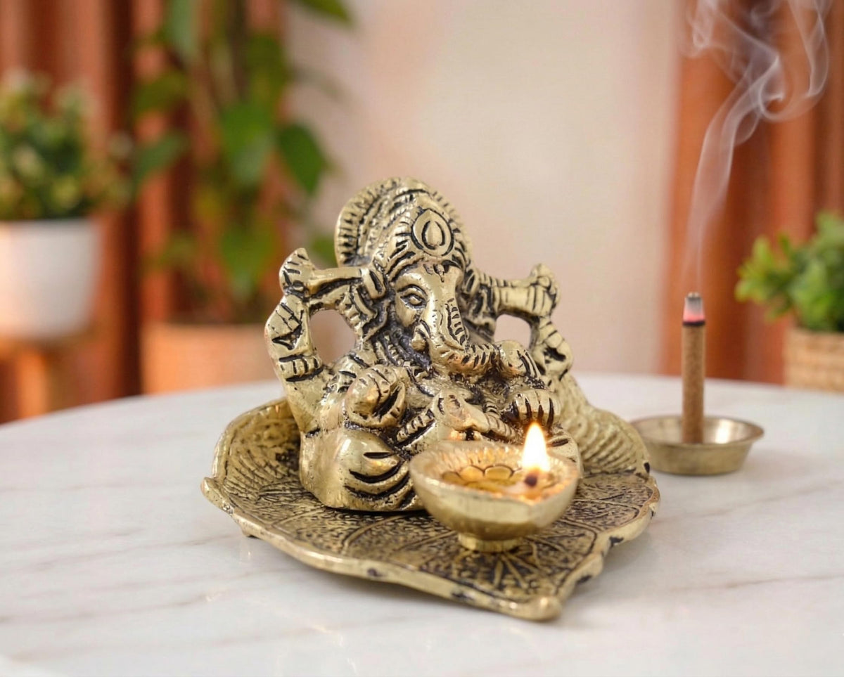 KridayKraft Metal Lord Ganesha On Leaf With Diya Idol For Pooja Room Showpiece For Room,Office & Table,Car And Gift For Have Anniversaries, Birthday, Gold