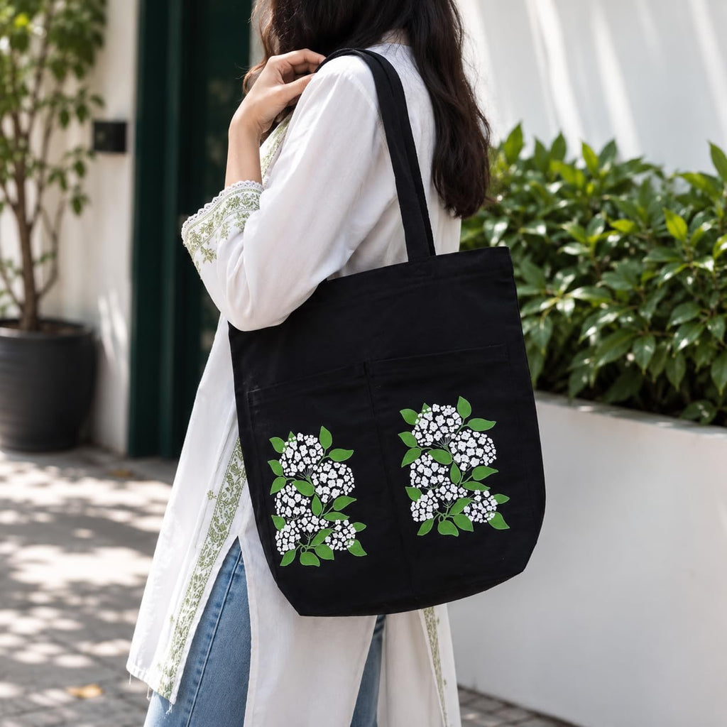 Suryatra Elderblossom Canvas Tote Bag for Women & Men | Premium Cotton Canvas Shoulder Bag with Dual Front Pockets | Tote Bag for Office, College, Shopping & Travel | Black | 14 x 16 Inches