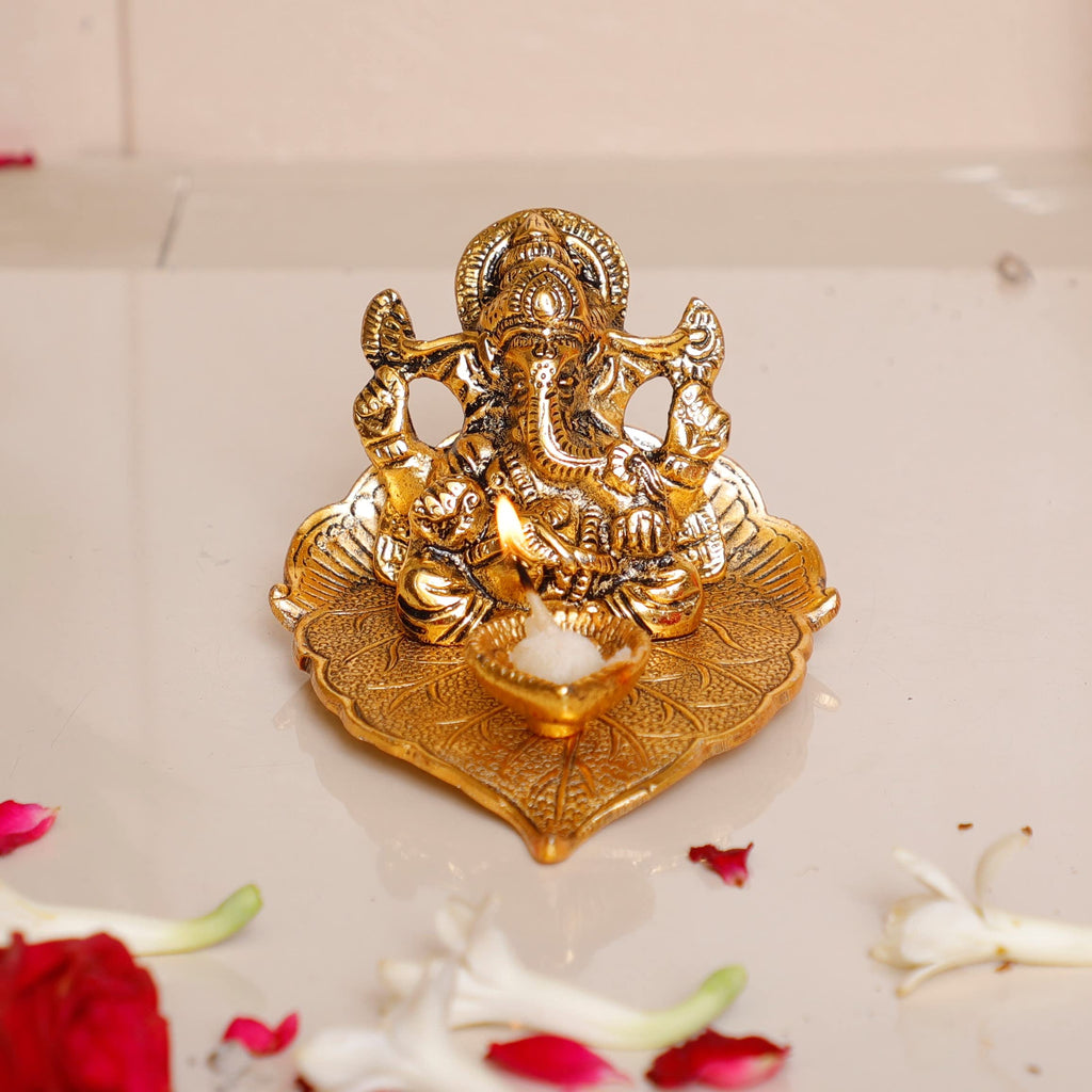 KridayKraft Metal Lord Ganesha On Leaf With Diya Idol For Pooja Room Showpiece For Room,Office & Table,Car And Gift For Have Anniversaries, Birthday, Gold