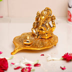 KridayKraft Metal Ganesha Sitting on Leaf Patta with Diya Deepak Home Office Temple Pooja/Festival Good Luck/Wishes/Diwali/Gifting Ganesh Gold Polish (12 x12 x 8 cm)