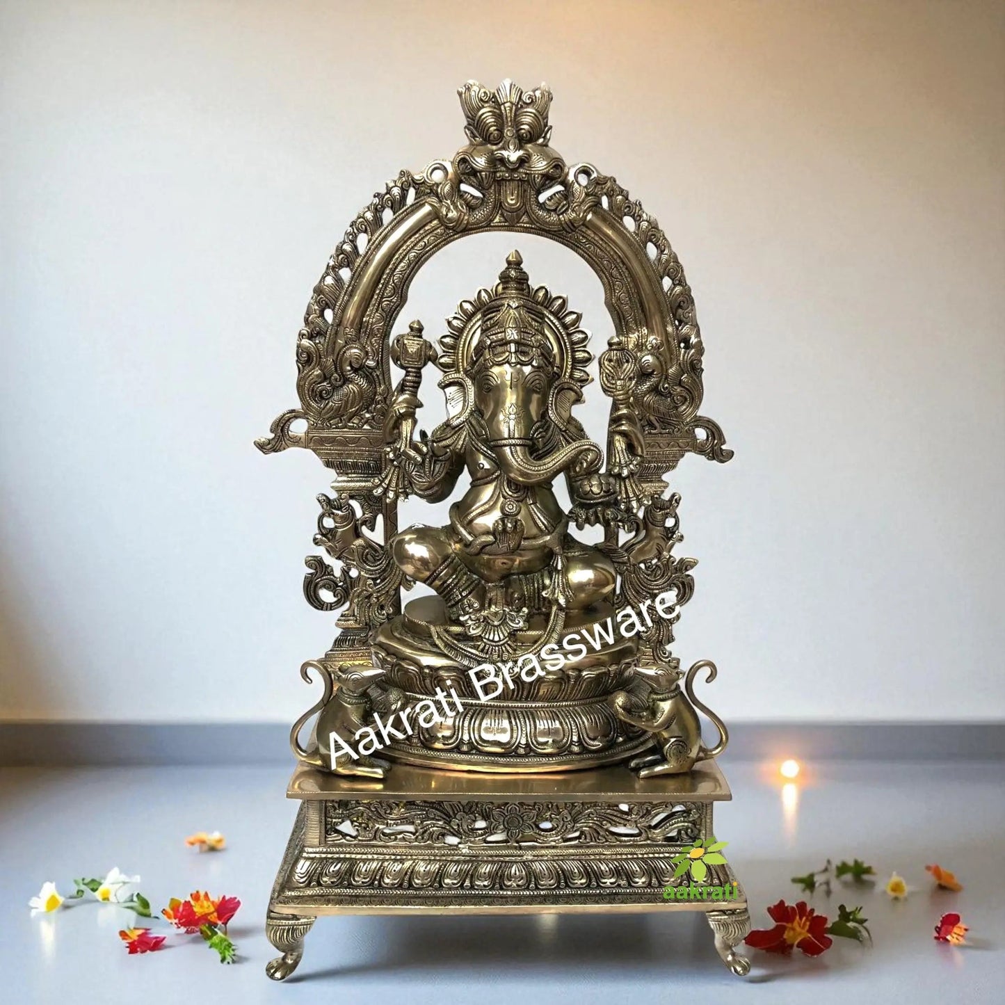 Lord Ganesha Sitting on a decorative throne hand carved brass statue