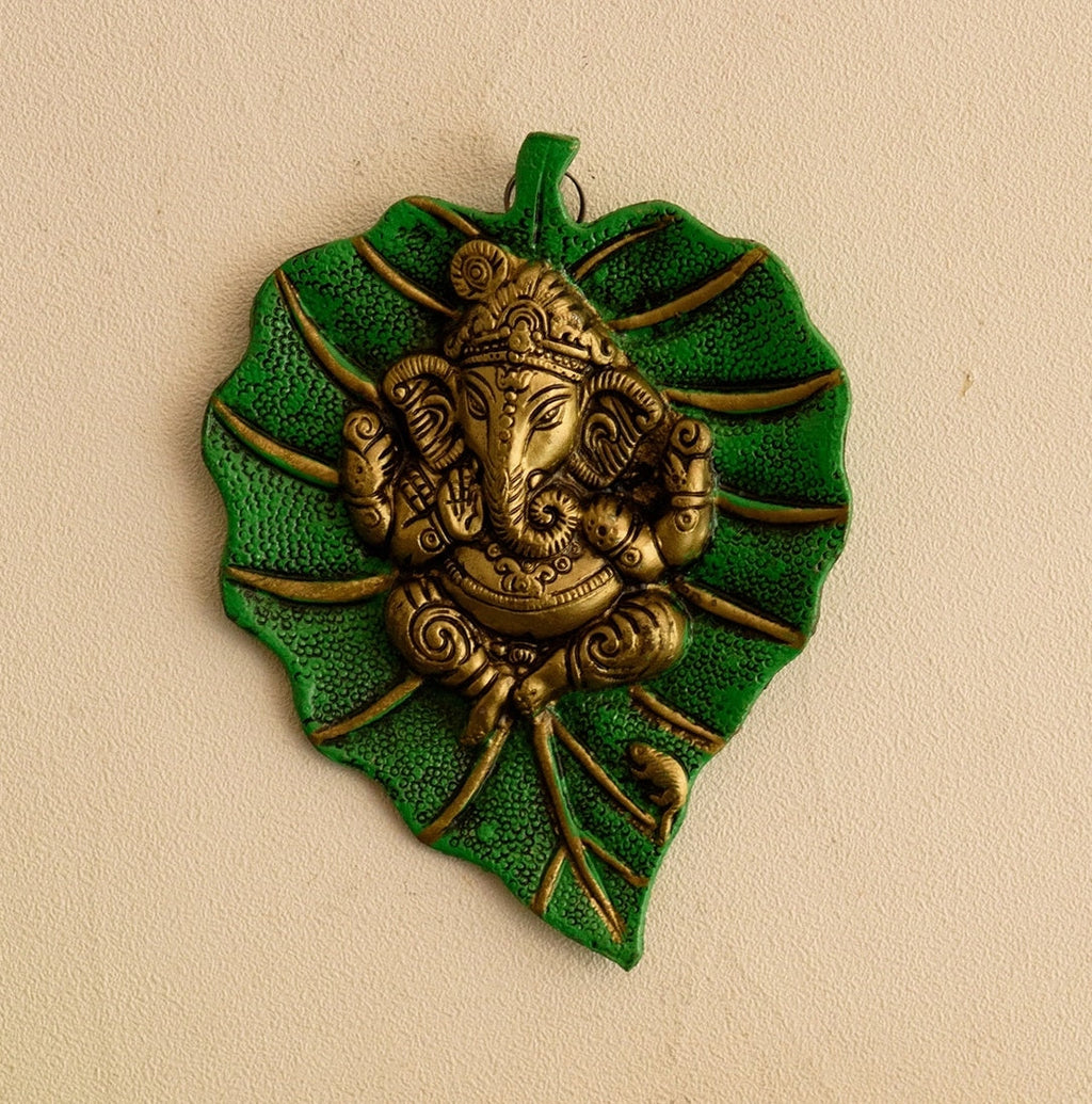 White Metal Golden Lord Ganesha on Green Leaf wall hanging Kafalo