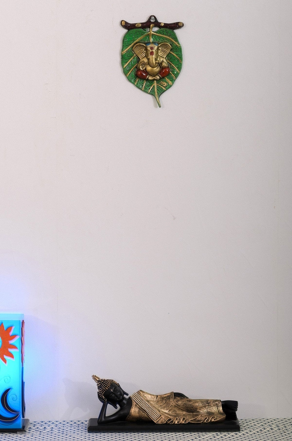 Golden Metal Lord Ganesha in Red Dhoti on Green Leaf Wall Hanging Kafalo