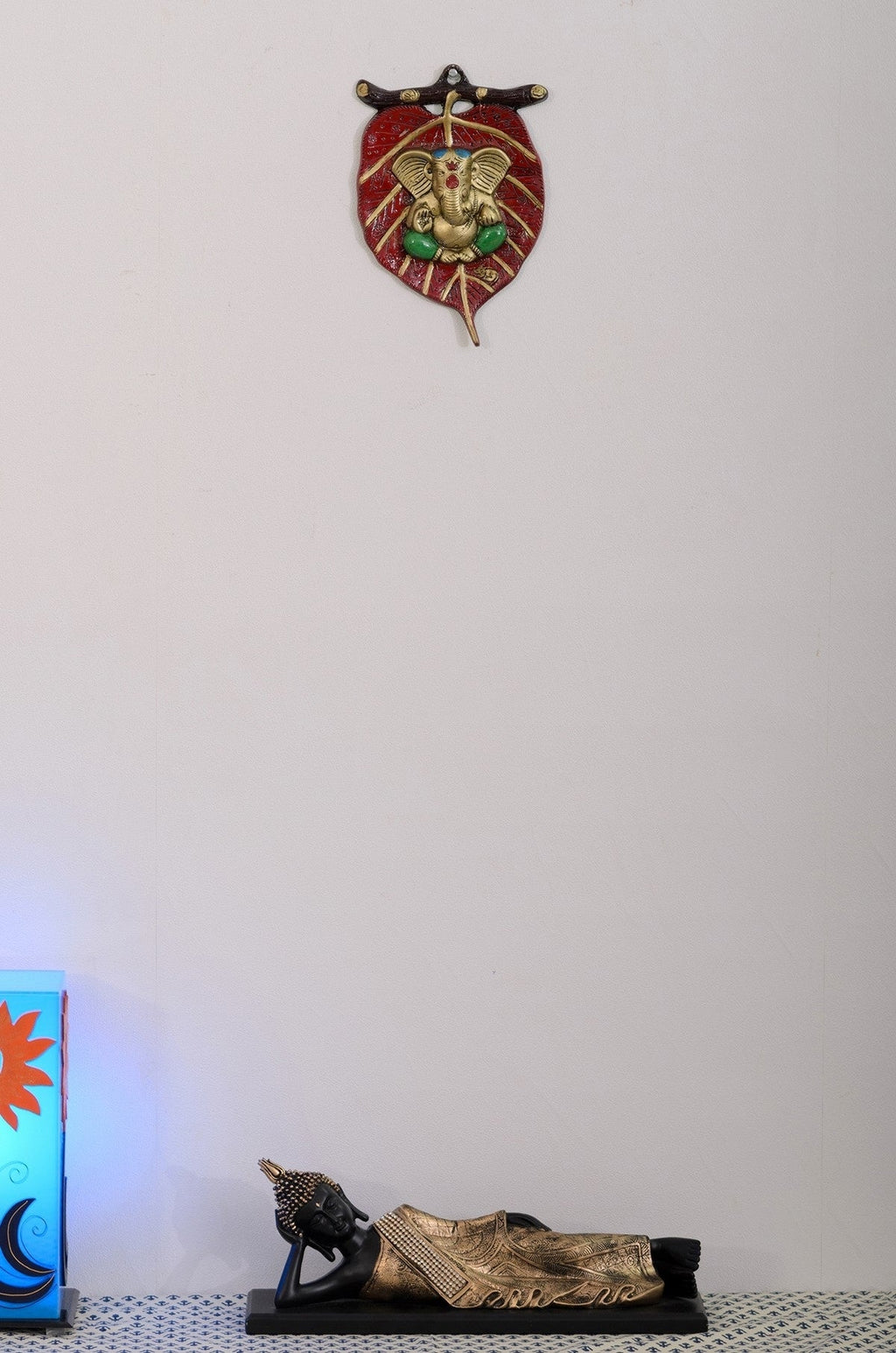 Golden Metal Lord Ganesha in Green Dhoti on Red Leaf Wall Hanging Kafalo