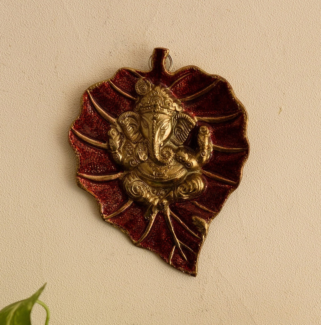 Golden Metal Lord Ganesha on Red Leaf wall hanging Kafalo