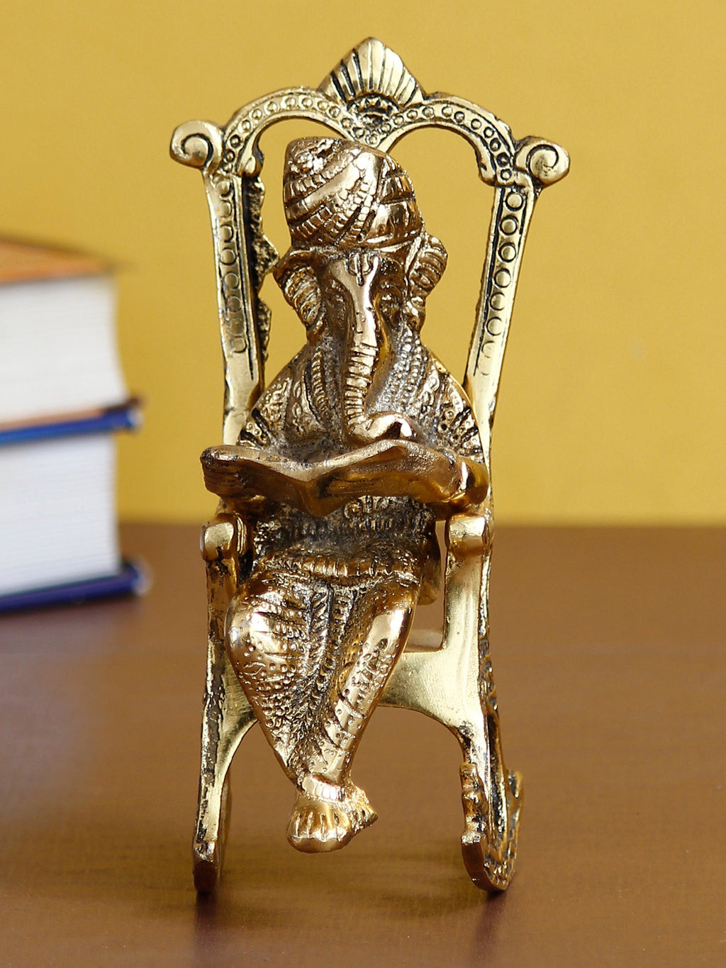 Golden Metal Lord Ganesha Idol Reading Book on Rocking Chair Kafalo