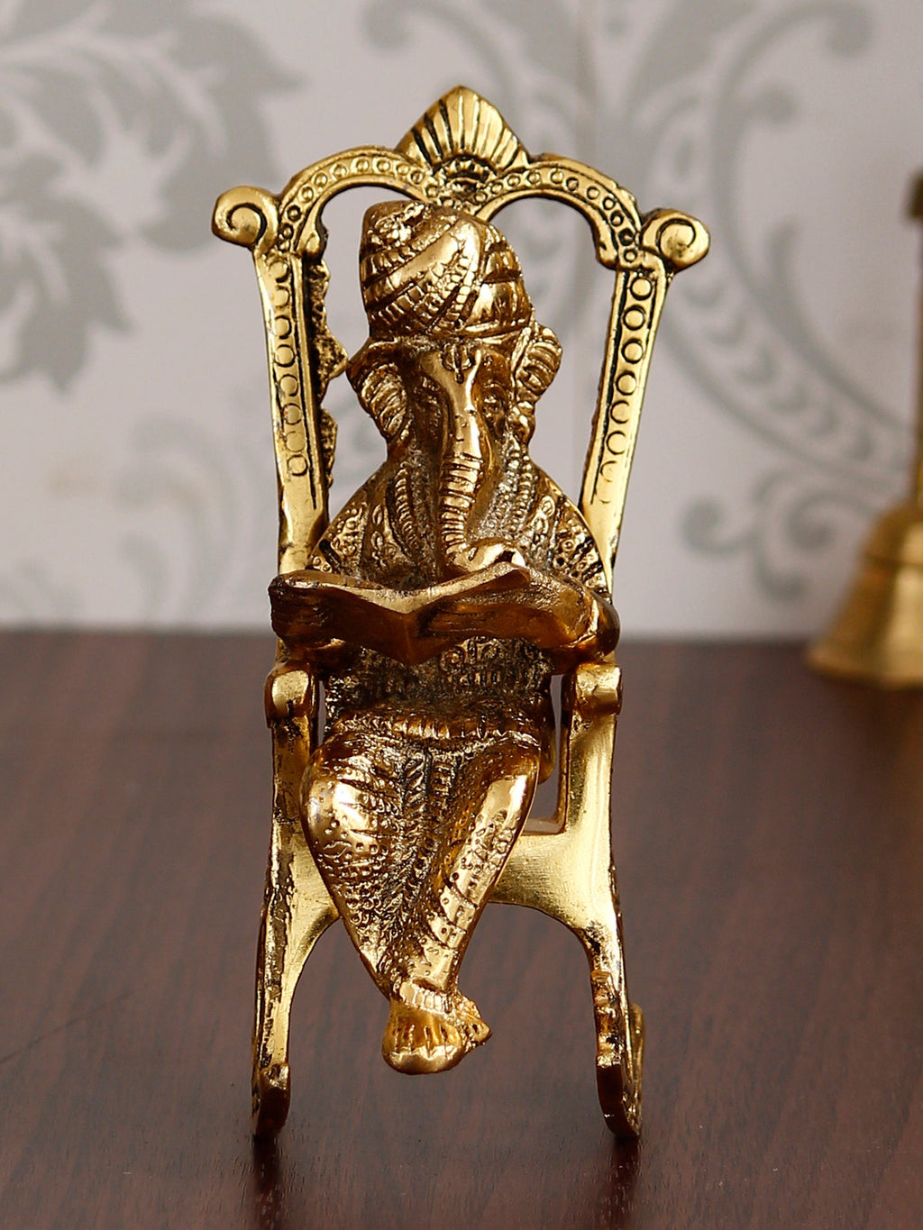 Golden Metal Lord Ganesha Idol Reading Book on Rocking Chair Kafalo
