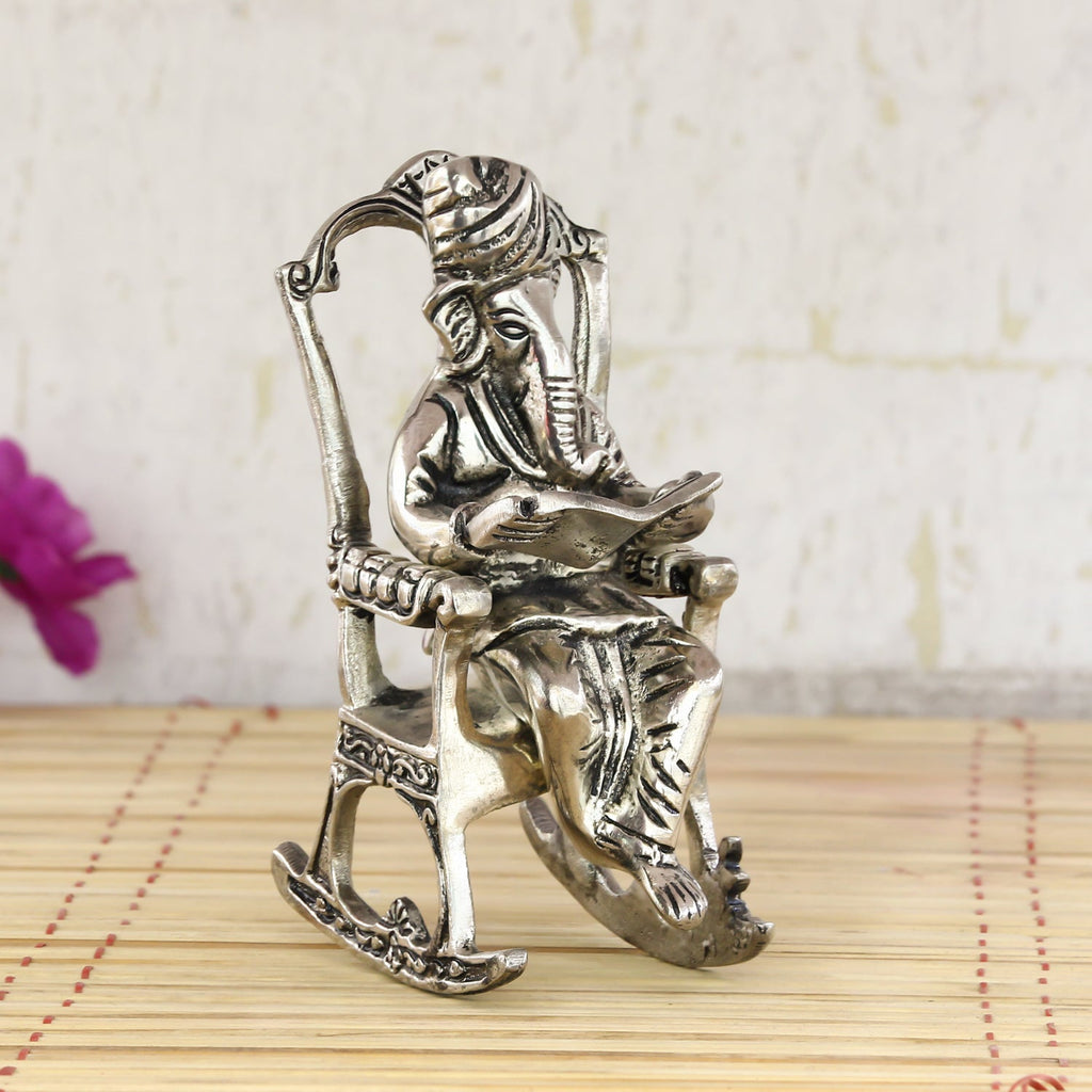 Silver Metal Lord Ganesha Idol Reading Book on Rocking Chair Kafalo