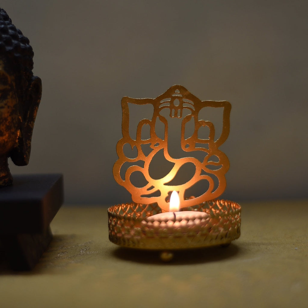 Metal Golden Lord Ganesha tea light candle holder that cast shadows Kafalo