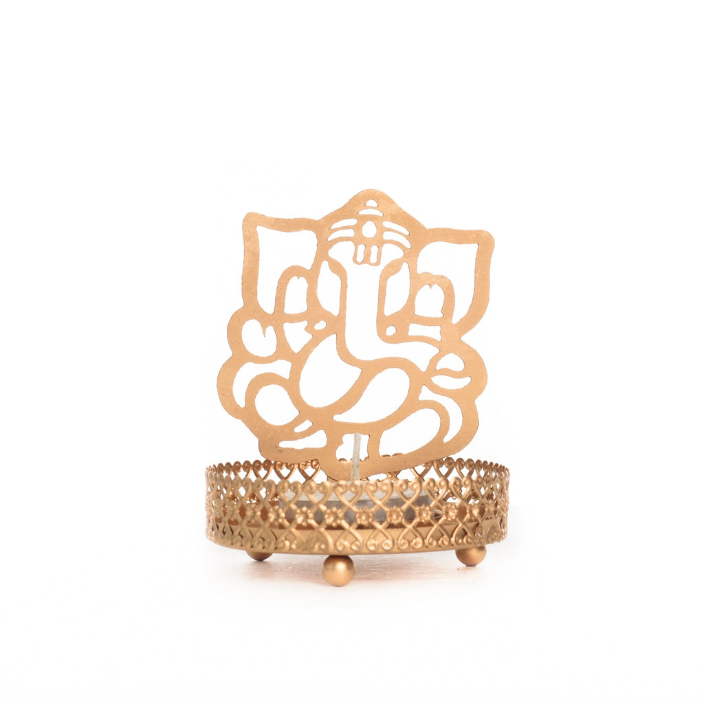 Metal Golden Lord Ganesha tea light candle holder that cast shadows Kafalo