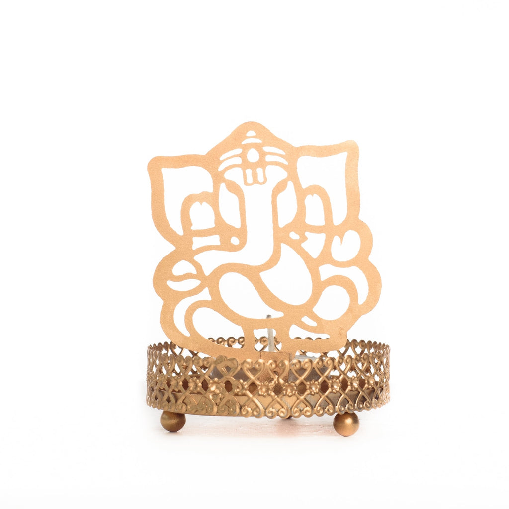Metal Golden Lord Ganesha tea light candle holder that cast shadows Kafalo