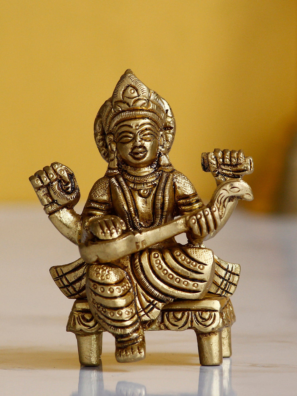 Golden Handcrafted Brass Goddess Saraswati Idol on Chowki Kafalo