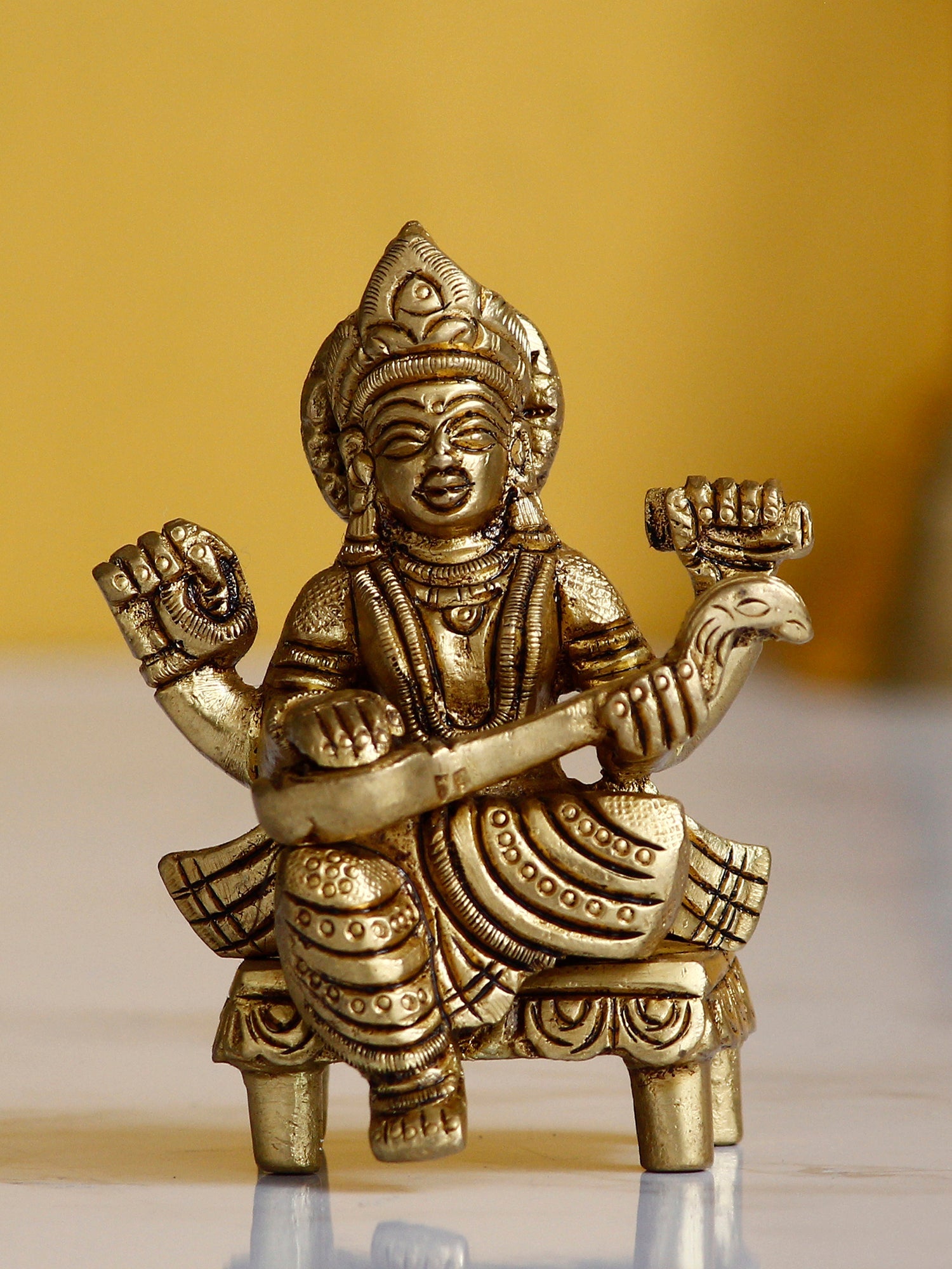Golden Handcrafted Brass Goddess Saraswati Idol on Chowki Kafalo