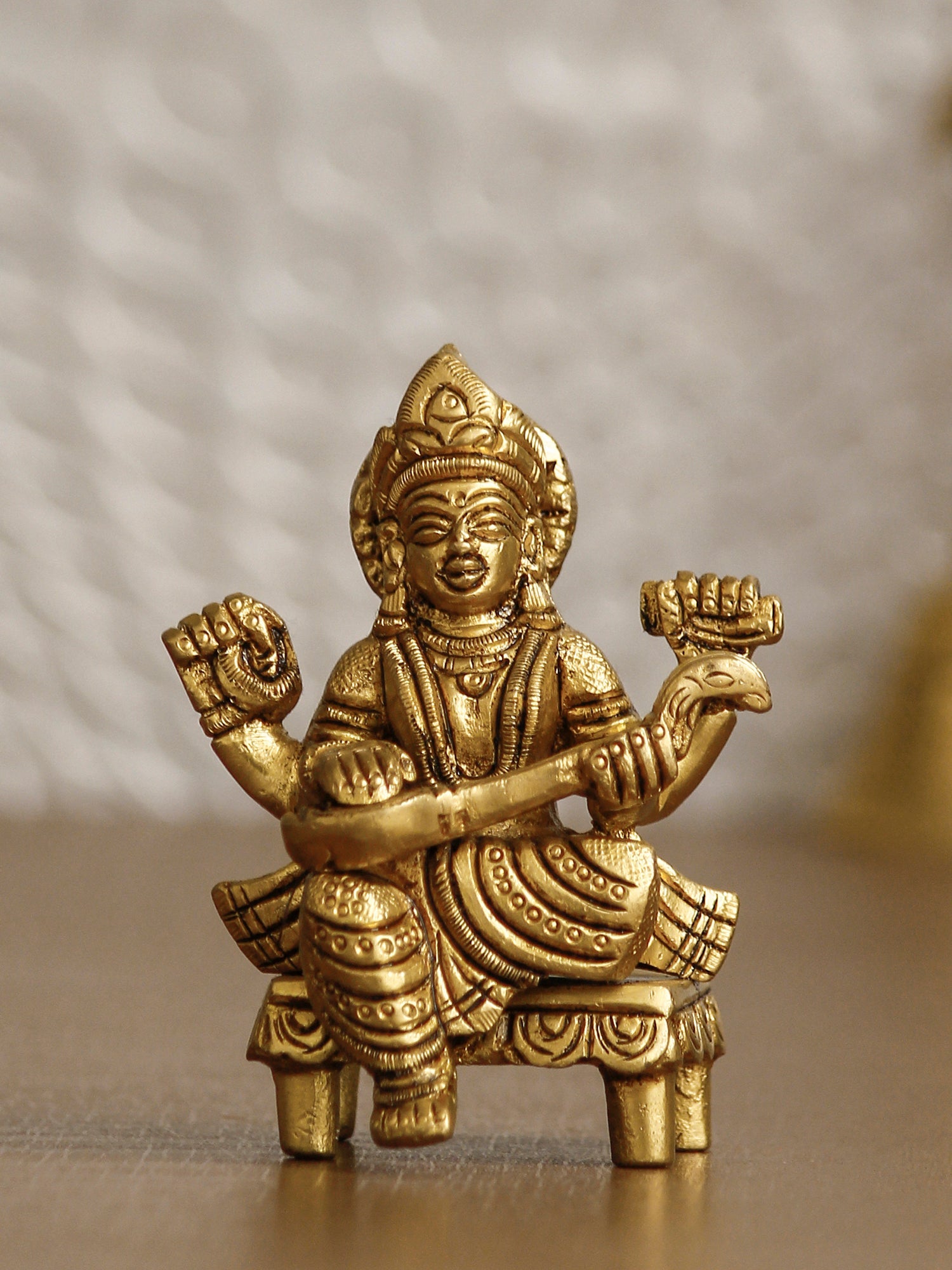 Golden Handcrafted Brass Goddess Saraswati Idol on Chowki Kafalo