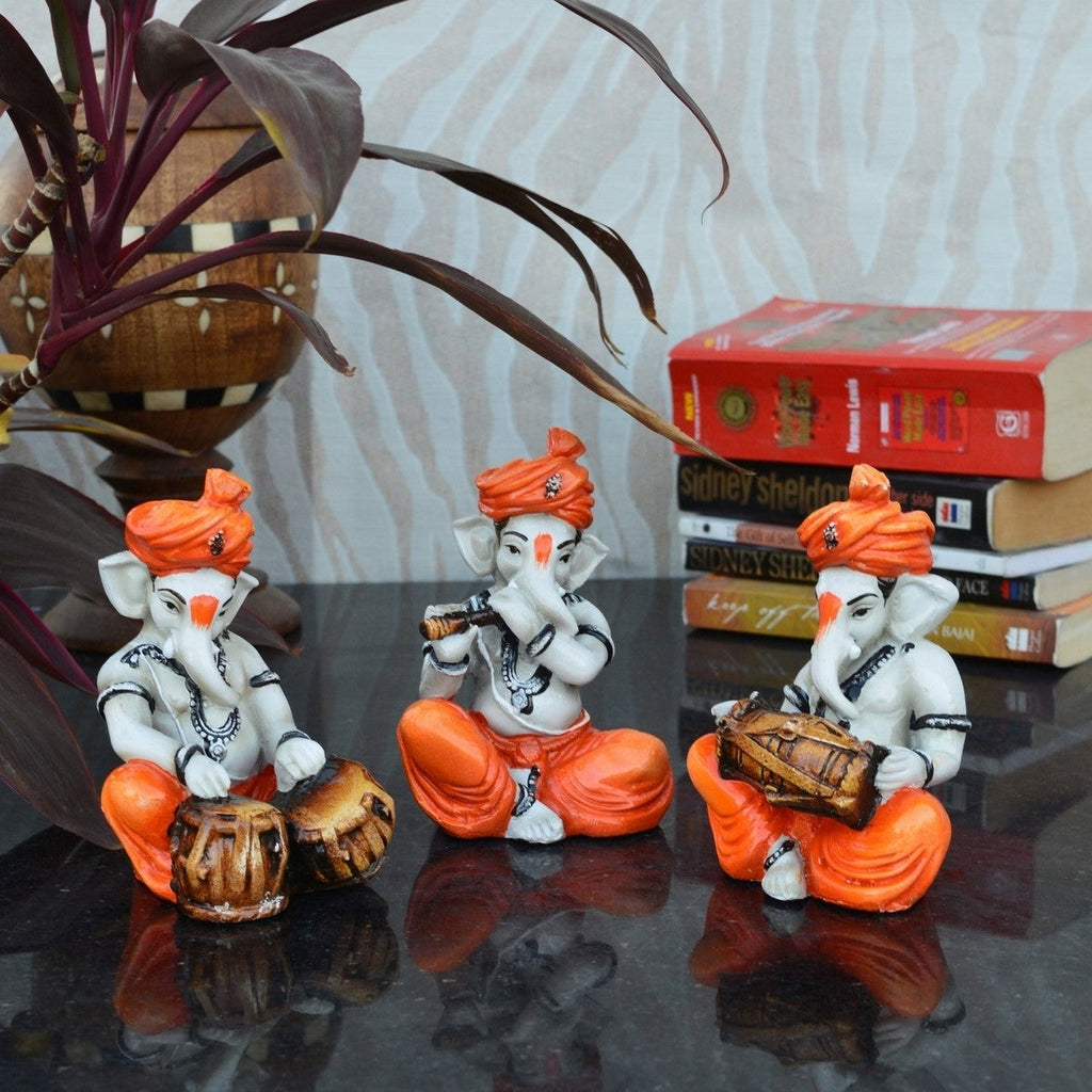 Orange Set of 3 Polyresin Ganesha Idol Playing Tabla, Flute and Dholak Kafalo