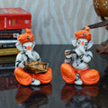 Set Of 2 Lord Ganesha Idols Playing Dholak And Flute Kafalo