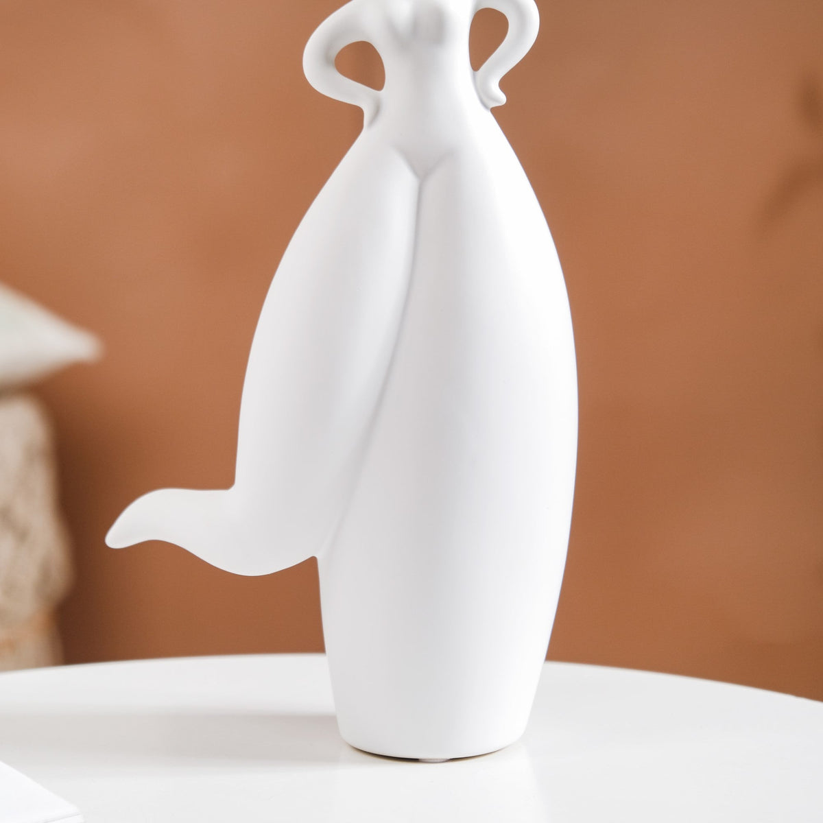 Dancing Girl Akimbo Ceramic Showpiece Nestasia