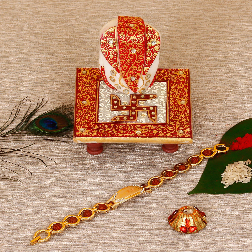 Designer Bracelet Religious Rakhi with Ridhi Sidhi Marble chowki and Roli Tikka Matki Kafalo