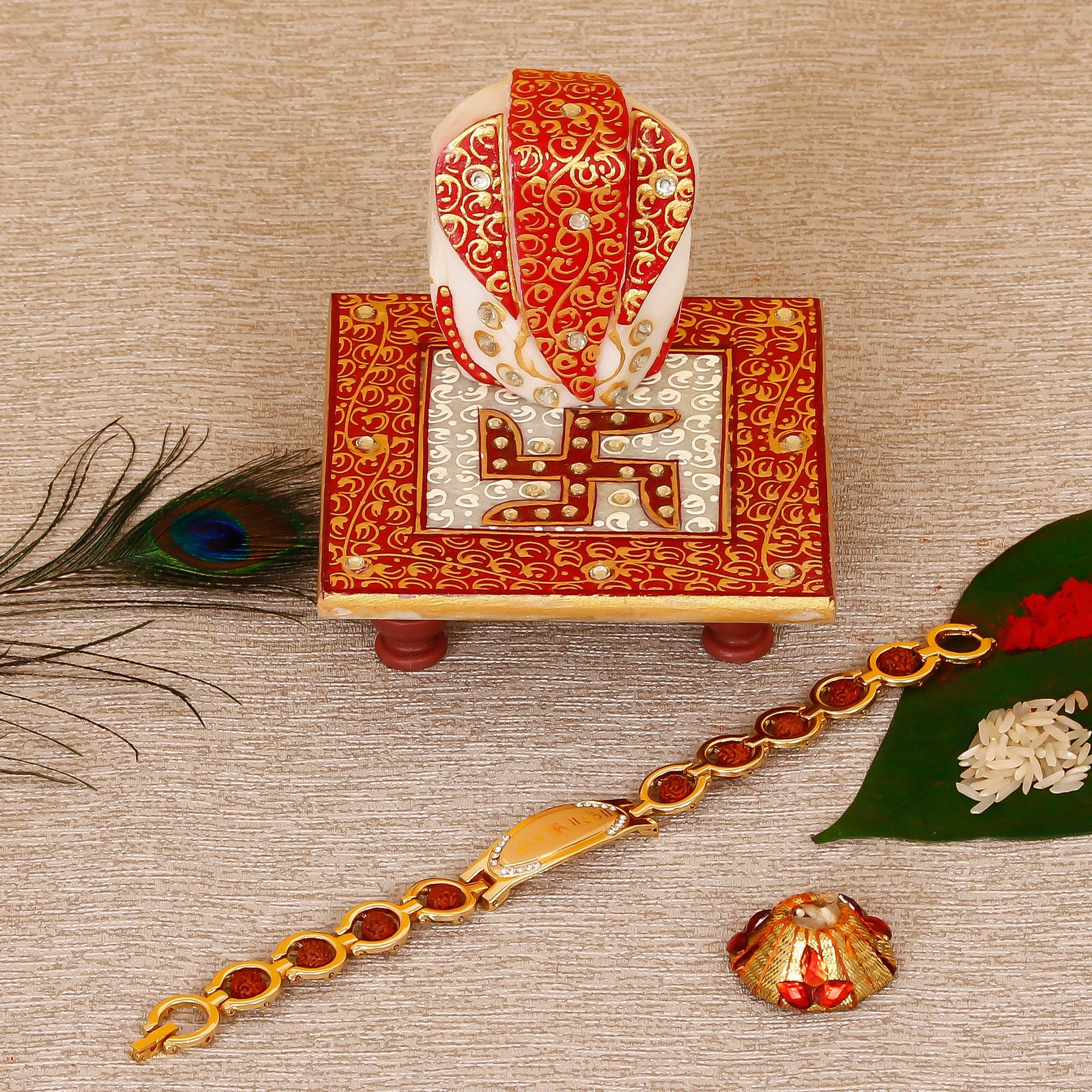 Designer Bracelet Religious Rakhi with Ridhi Sidhi Marble chowki and Roli Tikka Matki Kafalo