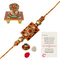Stone Rudraksh Rakhi with Lord Ganesha on Kundan Studded Marble Chowki and Roli Tikka Matki, Best Wishes Greeting Card Kafalo