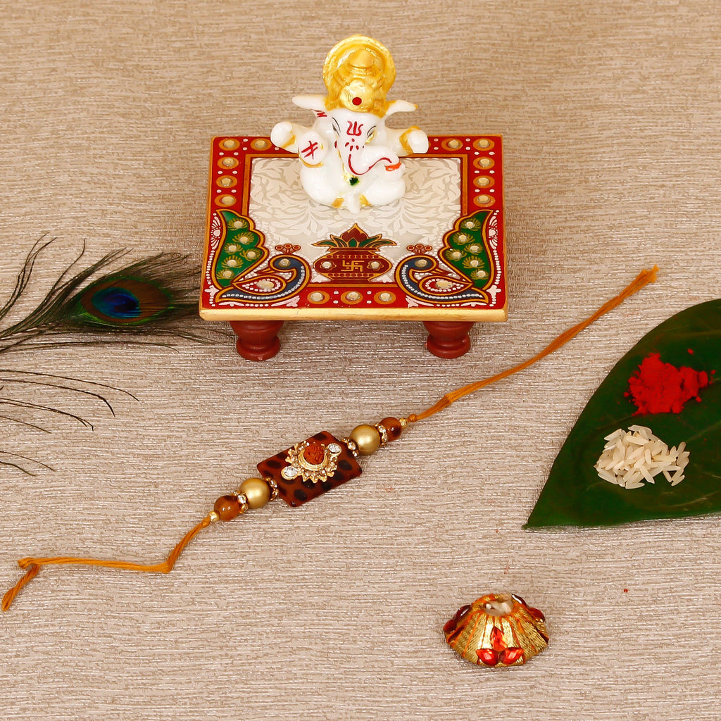 Stone Rudraksh Rakhi with Lord Ganesha Marble Chowki and Roli Tikka Matki Kafalo