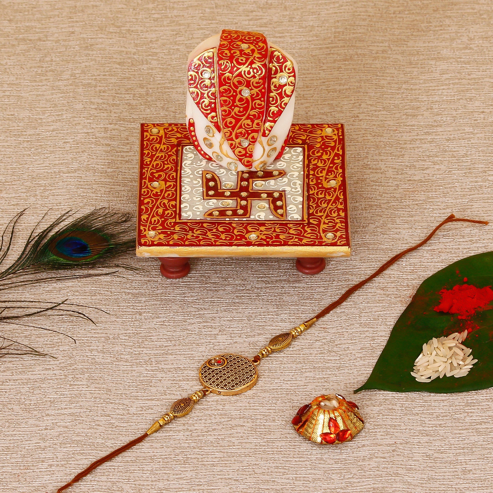 Designer Rakhi with Ridhi Sidhi Marble chowki and Roli Tikka Matki Kafalo