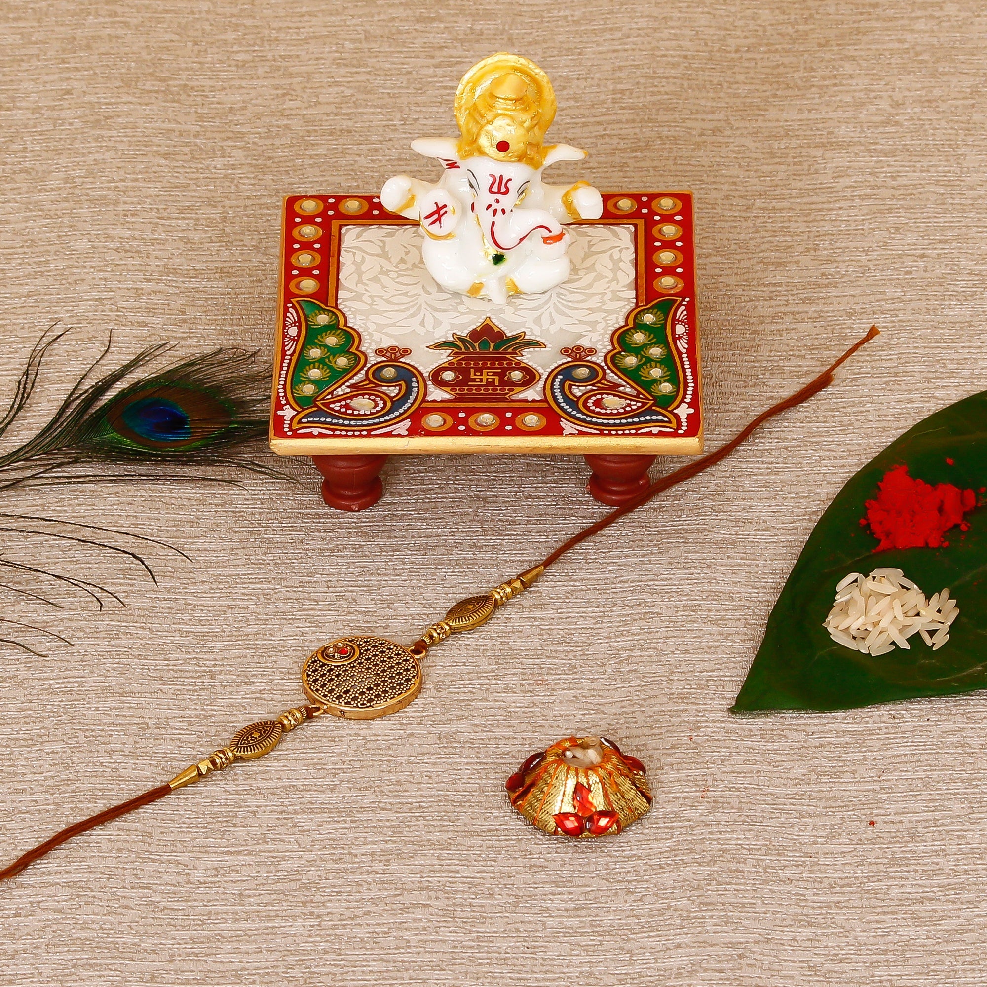 Designer Rakhi with Lord Ganesha Marble Chowki and Roli Tikka Matki Kafalo