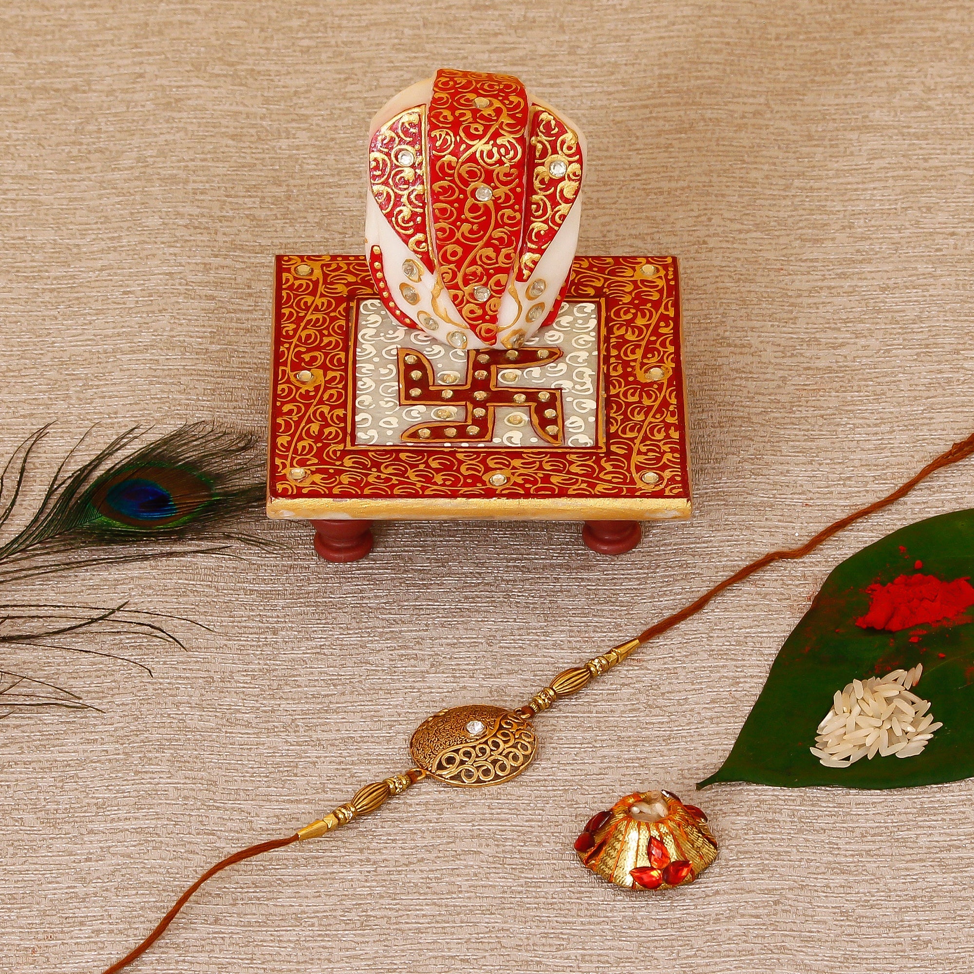 Designer Rakhi with Ridhi Sidhi Marble chowki and Roli Tikka Matki Kafalo