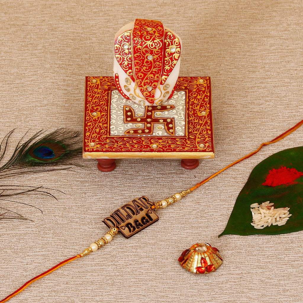 Designer Wooden Dildar Bhai Rakhi with Ridhi Sidhi Marble chowki and Roli Tikka Matki Kafalo