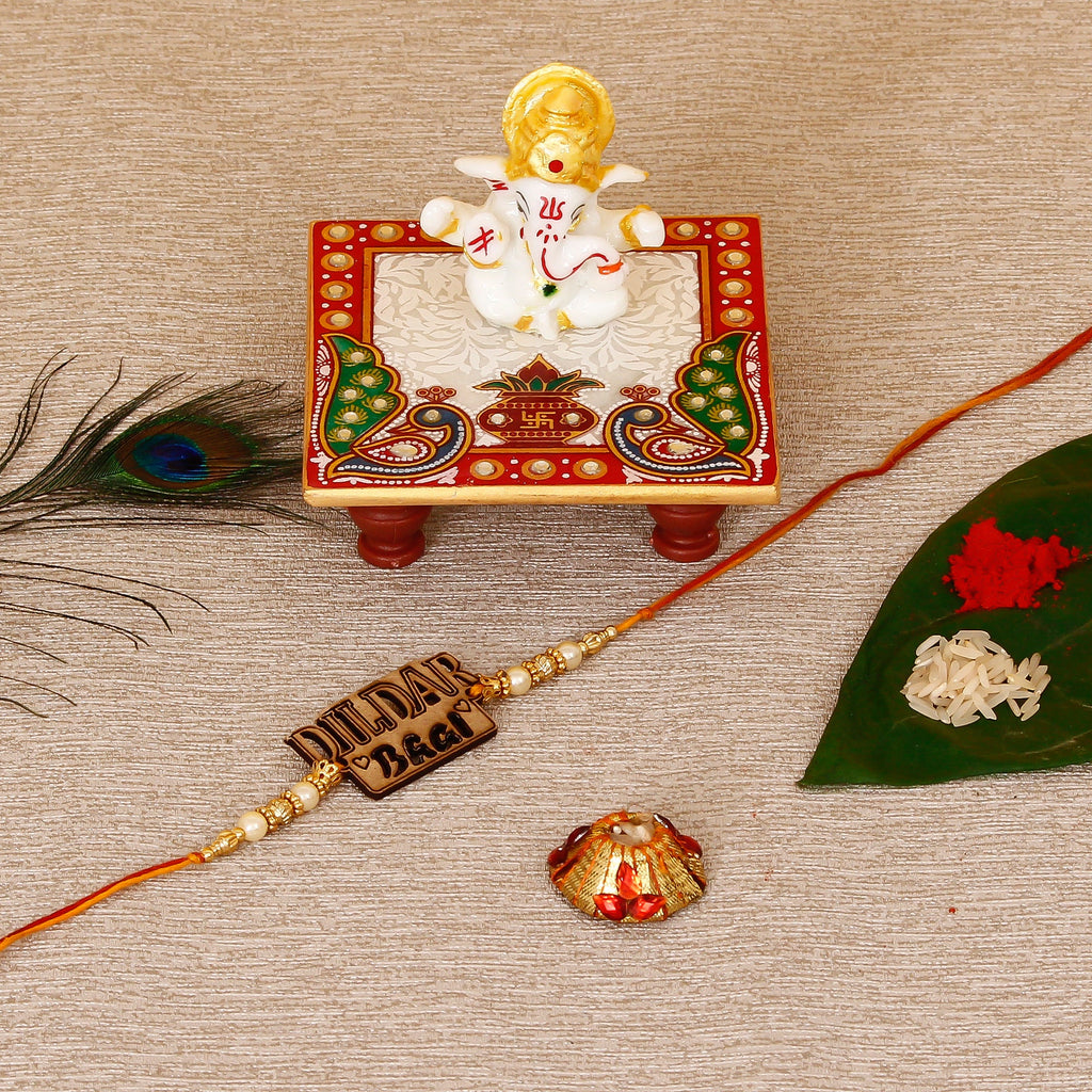 Designer Wooden Dildar Bhai Rakhi with Lord Ganesha Marble Chowki and Roli Tikka Matki Kafalo