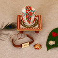 Designer Leather Bracelet BRO Rakhi with Lord Ganesha on Kundan Studded Marble Chowki and Roli Tikka Matki Kafalo