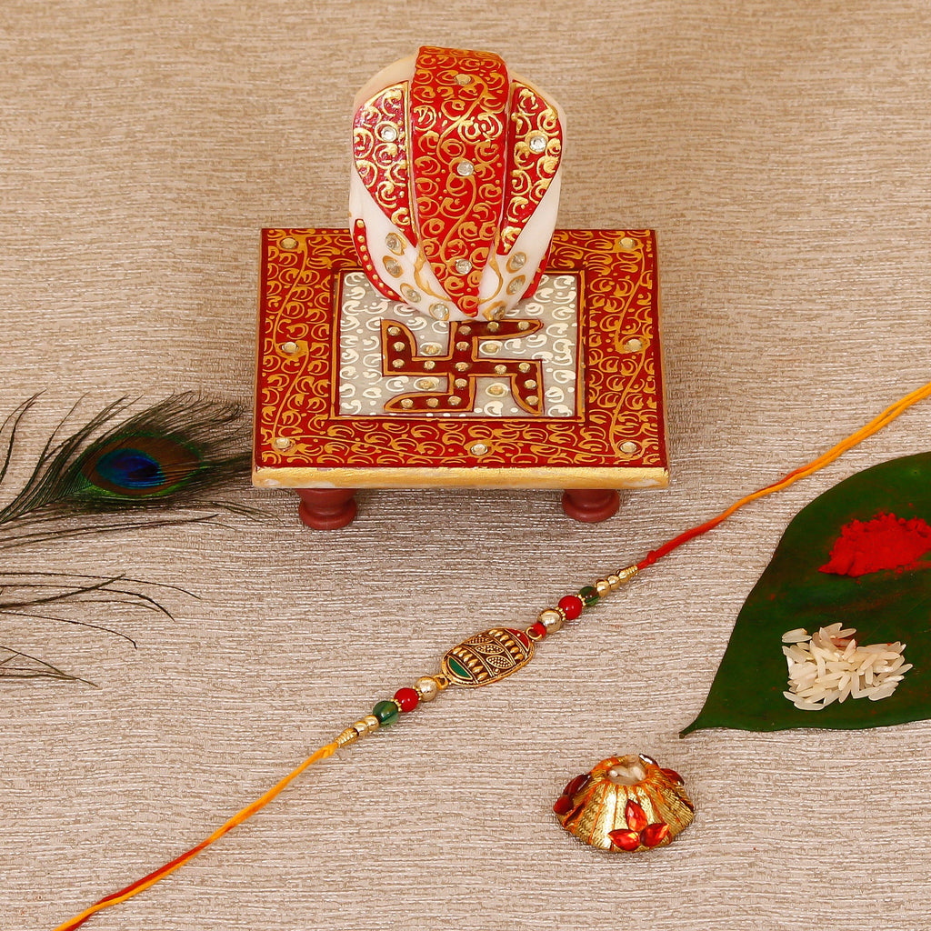 Designer Rakhi with Ridhi Sidhi Marble chowki and Roli Tikka Matki Kafalo
