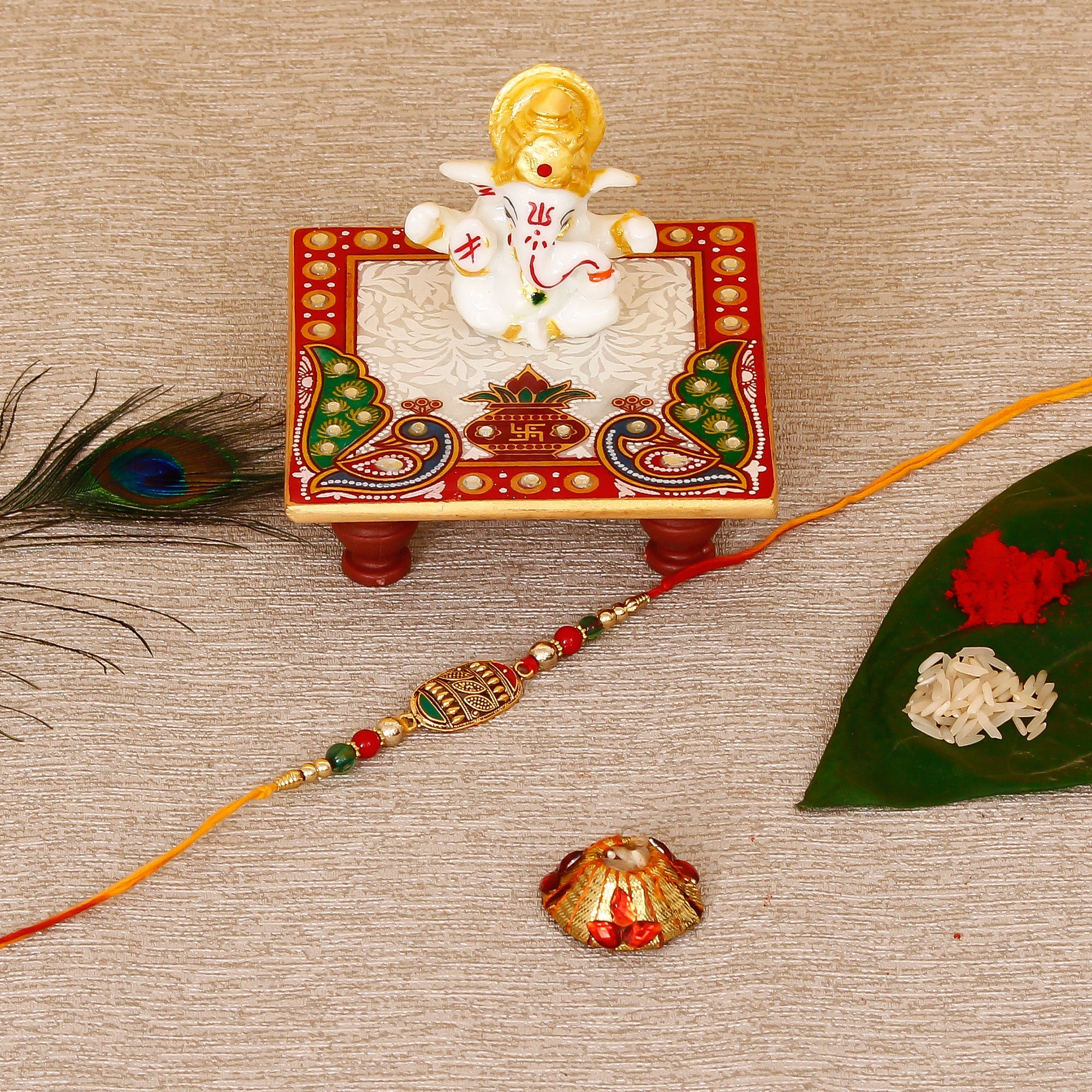 Designer Rakhi with Lord Ganesha Marble Chowki and Roli Tikka Matki Kafalo