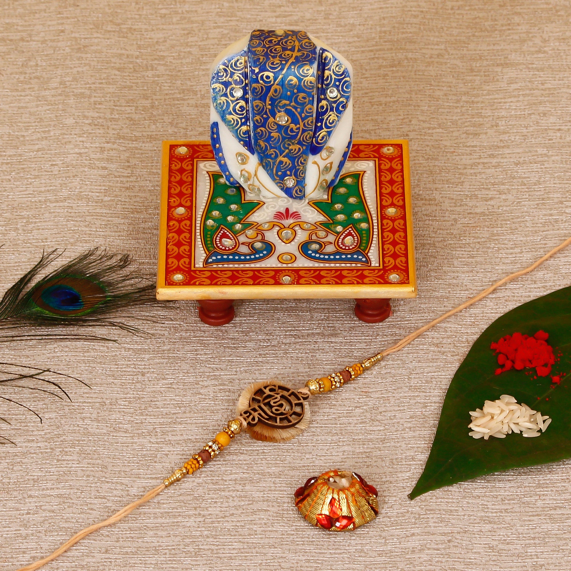Designer Wooden Bhai Rakhi with Lord Ganesha on Marble Chowki and Roli Tikka Matki Kafalo