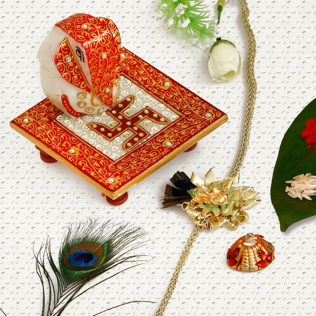 Designer Ganesha Mor Pankh Rakhi with Ridhi Sidhi Marble chowki and Roli Tikka Matki Kafalo