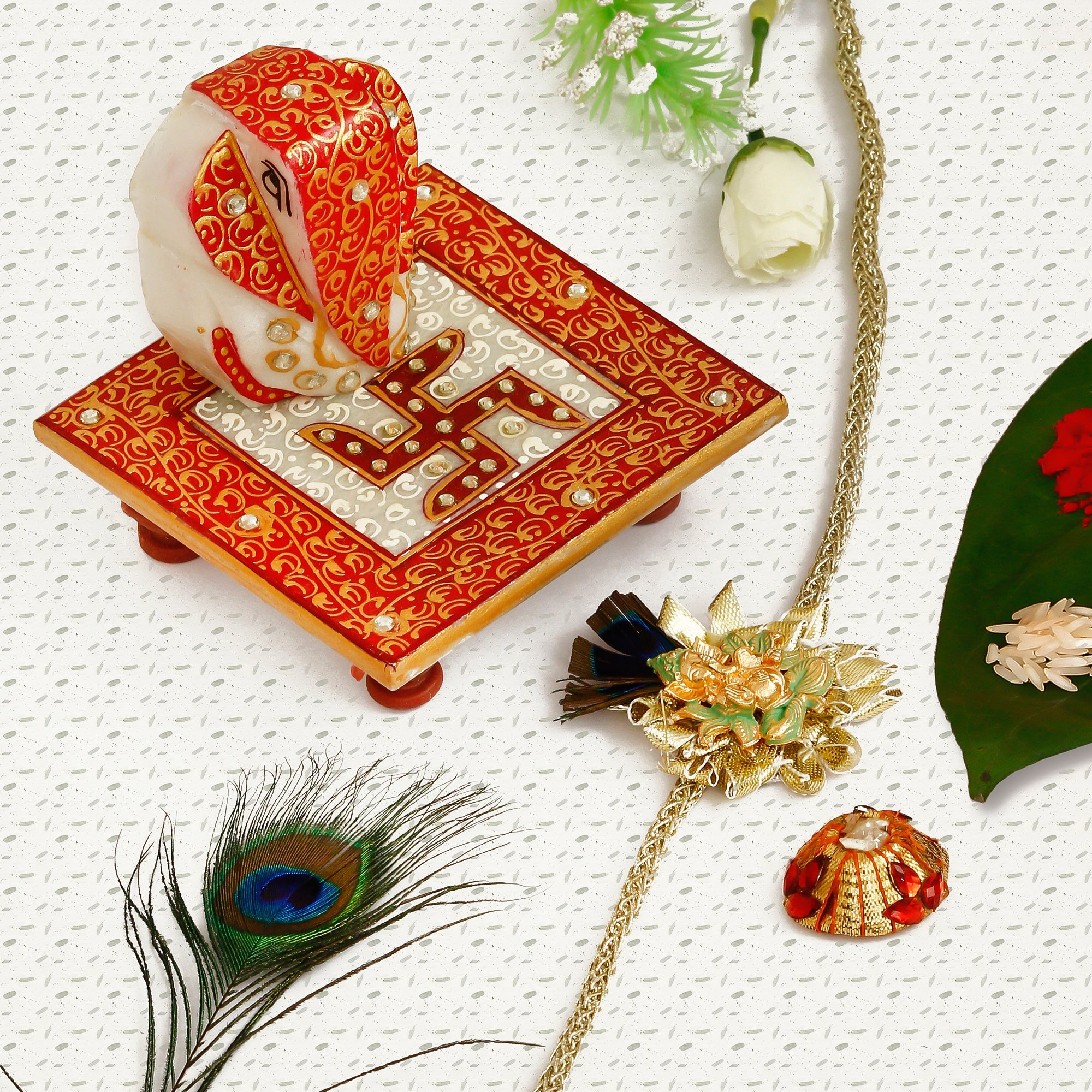 Designer Ganesha Mor Pankh Rakhi with Ridhi Sidhi Marble chowki and Roli Tikka Matki Kafalo
