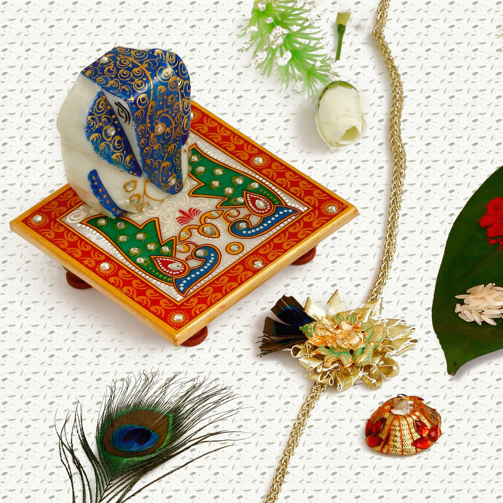 Designer Ganesha Mor Pankh Rakhi with Lord Ganesha on Marble Chowki and Roli Tikka Matki Kafalo