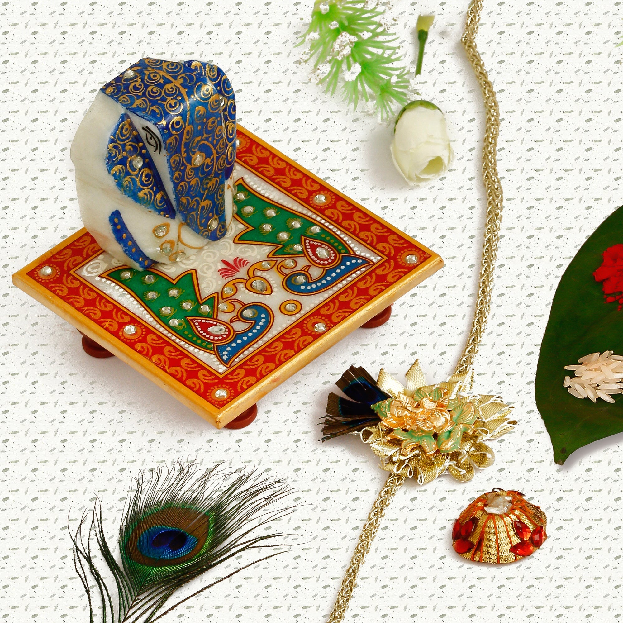 Designer Ganesha Mor Pankh Rakhi with Lord Ganesha on Marble Chowki and Roli Tikka Matki Kafalo