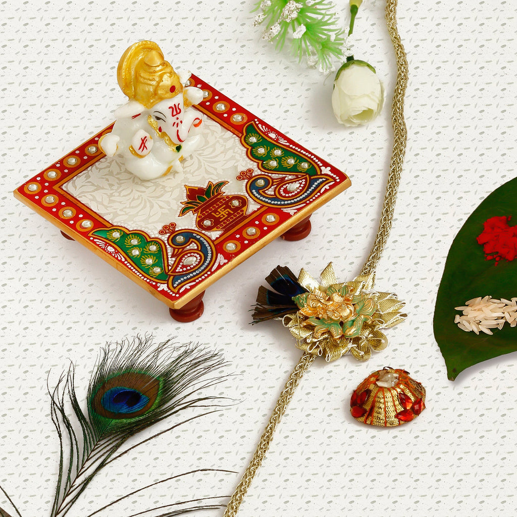 Designer Ganesha Mor Pankh Rakhi with Lord Ganesha Marble Chowki and Roli Tikka Matki Kafalo