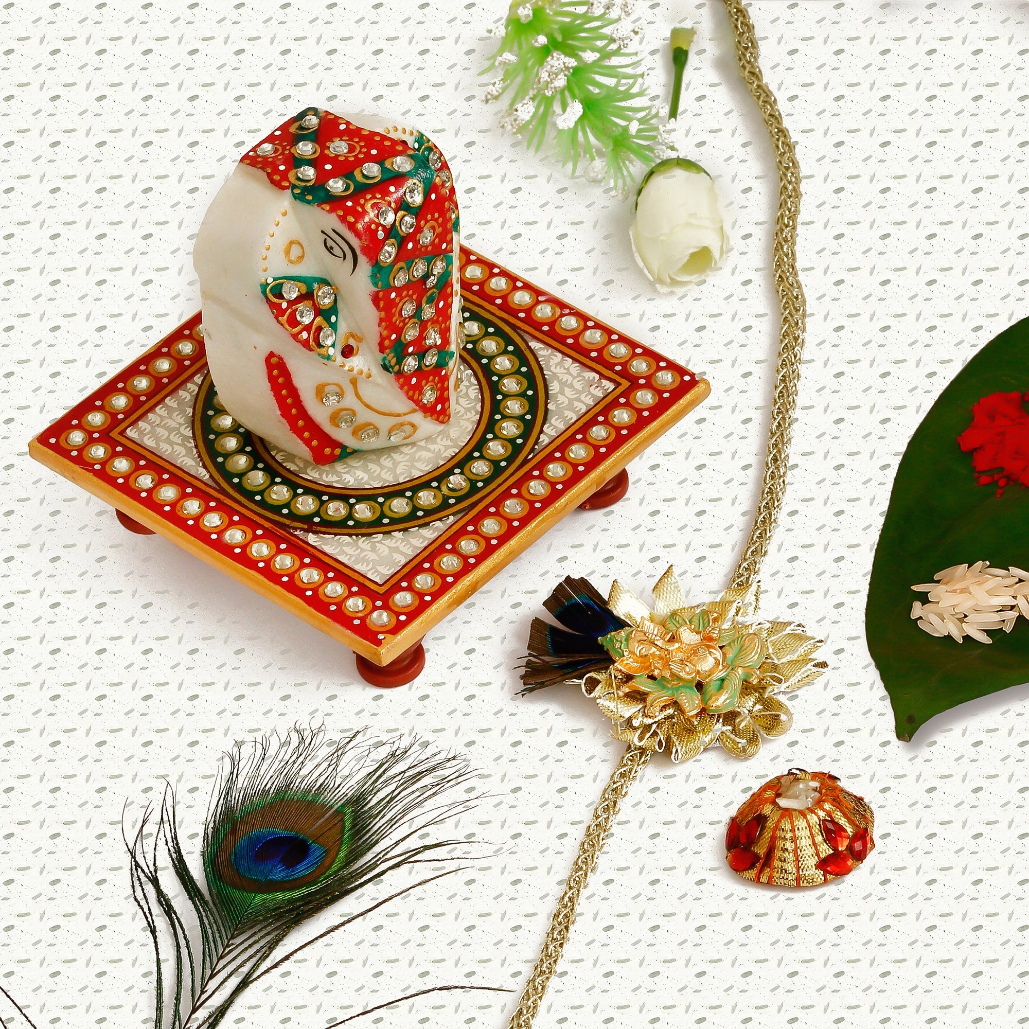 Designer Ganesha Mor Pankh Rakhi with Lord Ganesha on Kundan Studded Marble Chowki and Roli Tikka Matki Kafalo