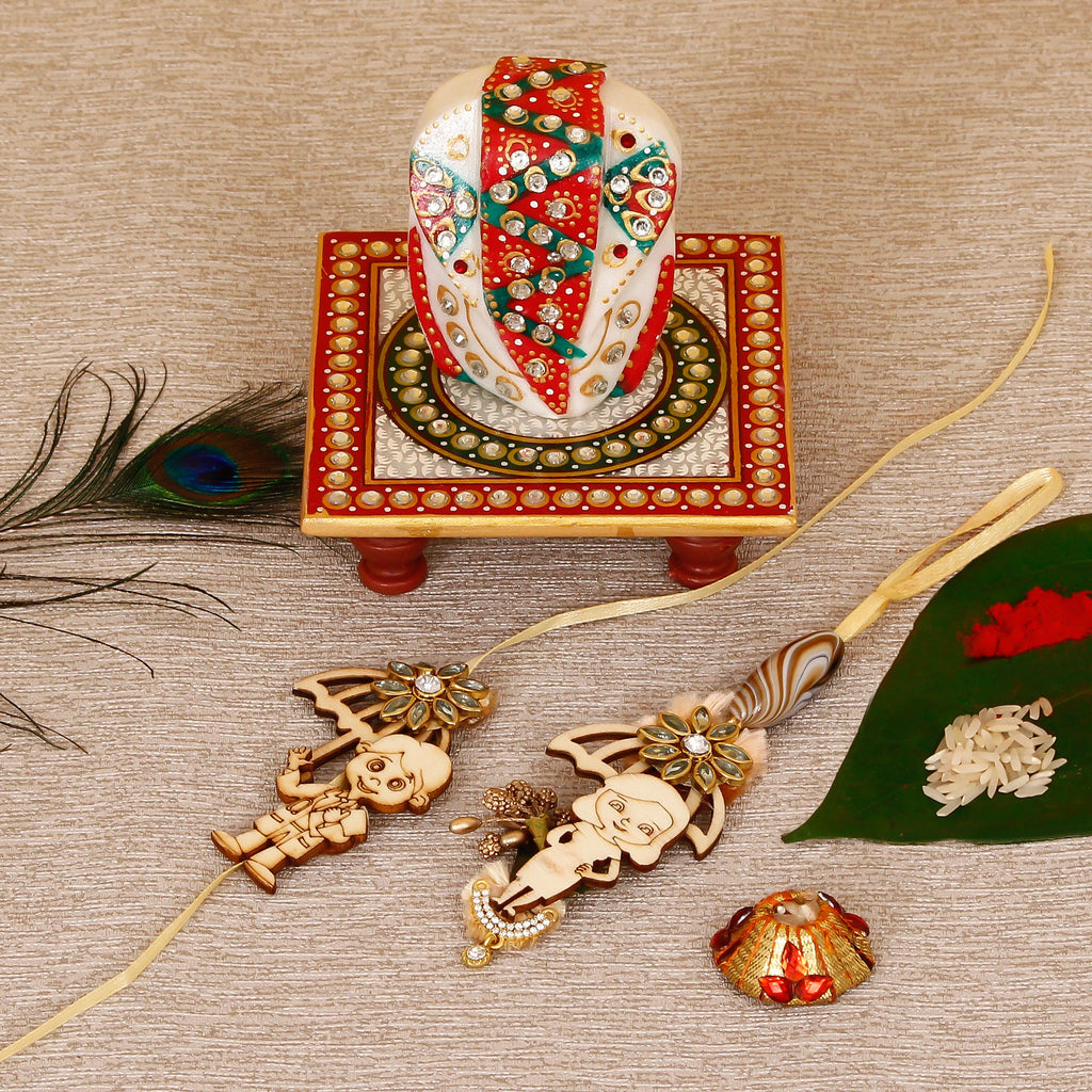 Designer Bhaiya Bhabhi Rakhi with Lord Ganesha on Kundan Studded Marble Chowki and Roli Tikka Matki Kafalo