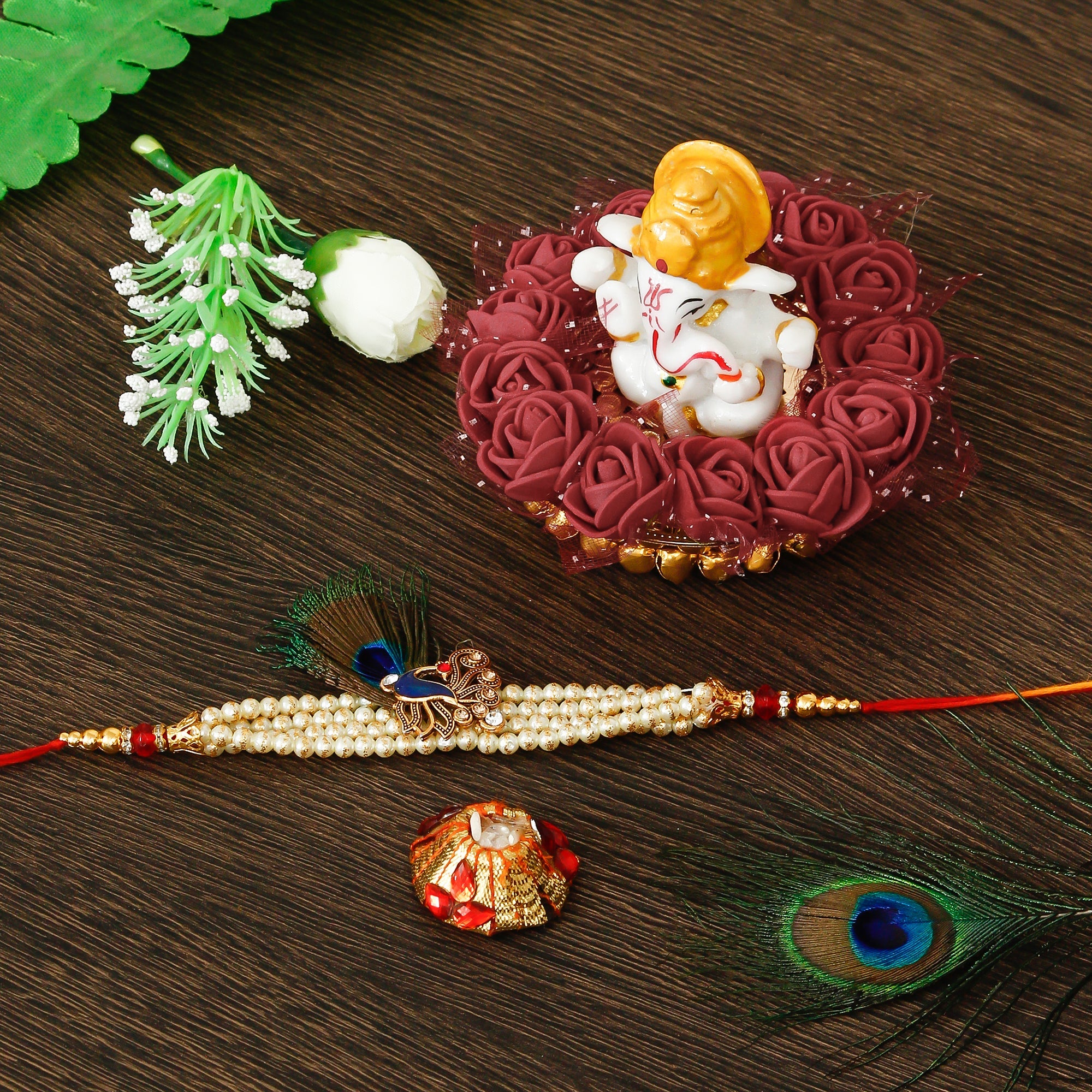 Designer Pearl Morpankh Rakhi with Lord Ganesha Idol on Decorative Plate for Car & Home and Roli Tikka Matki Kafalo