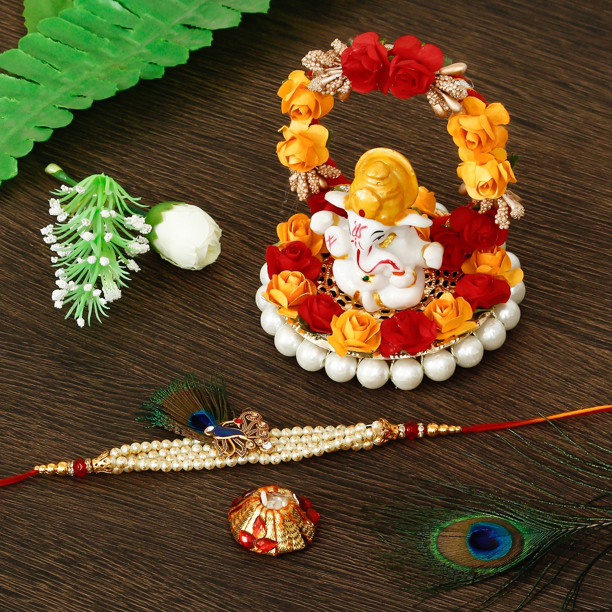 Designer Pearl Morpankh Rakhi with Lord Ganesha Idol on Decorative Plate for Car & Home and Roli Tikka Matki Kafalo